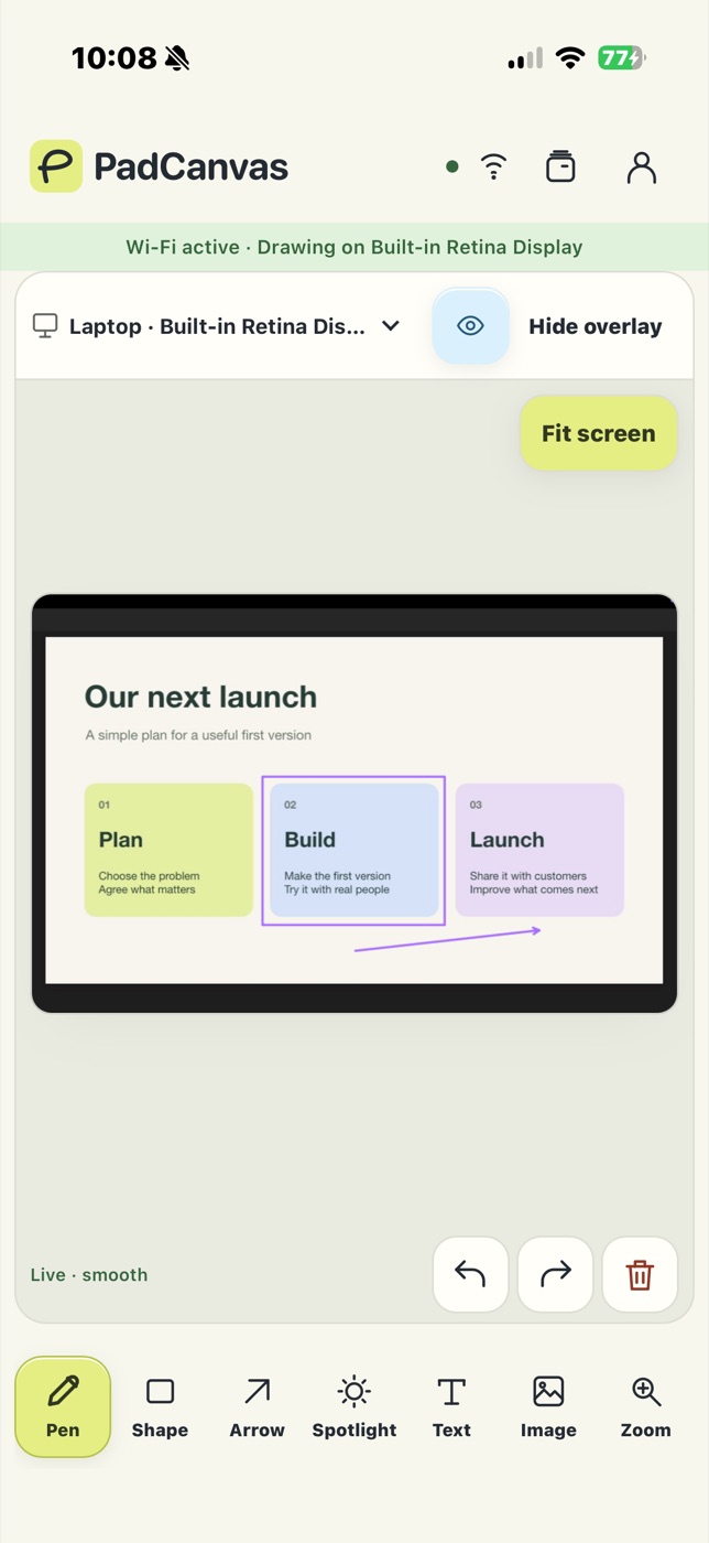 PadCanvas companion on an iPhone over Wi‑Fi, showing a slide titled “Our next launch” with a purple box and arrow drawn over it.